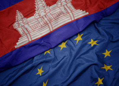 waving colorful flag of european union and flag of cambodia.macro